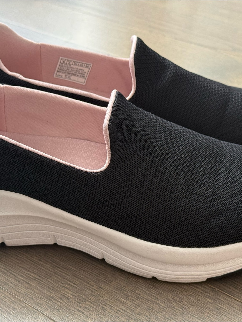 Skechers Black Slip-On Sneakers with Pink Interior and White Sole